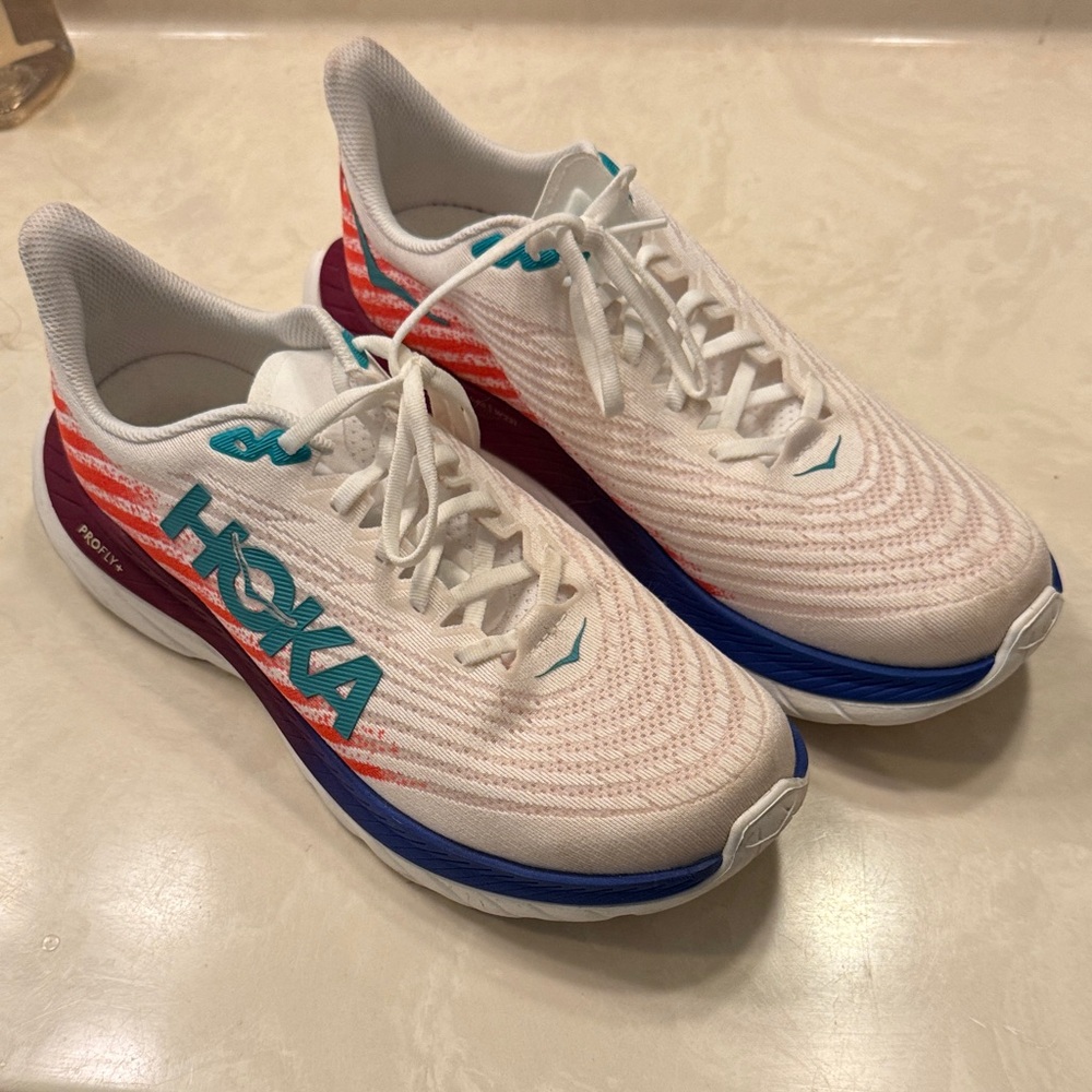 Hoka White and Red Running Shoes with Blue Accents